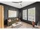 Cozy living room featuring dark walls, natural light, and minimalist decor at 14617 Galt Lake Dr, Tampa, FL 33626