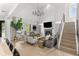 The bright living room features a cozy fireplace, large windows, and comfortable seating at 14617 Galt Lake Dr, Tampa, FL 33626