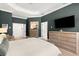 Spacious primary bedroom with tray ceiling and ensuite bathroom entrances at 14617 Galt Lake Dr, Tampa, FL 33626