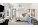 Elegant main bedroom with a four-poster bed, soft natural light, and a soothing color palette at 14617 Galt Lake Dr, Tampa, FL 33626