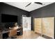 Home office setup featuring a wooden desk, a comfortable chair, and modern decor at 14617 Galt Lake Dr, Tampa, FL 33626