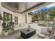 Covered patio area with view of the pool, spa and outdoor furniture at 14617 Galt Lake Dr, Tampa, FL 33626