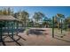 Community playground featuring swings, climbing structures, slides, and safety surfacing at 14617 Galt Lake Dr, Tampa, FL 33626
