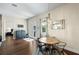 Bright dining room features a round table, chandelier, and sliding door to the outside at 15415 Otto Rd, Tampa, FL 33624