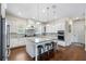 Modern kitchen features stainless steel appliances and an island with pendant lighting and bar stool seating at 15415 Otto Rd, Tampa, FL 33624