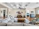 Comfortable living room featuring hardwood floors, coffered ceiling, and large grey couch at 15415 Otto Rd, Tampa, FL 33624