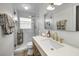 Renovated bathroom featuring gold hardware, stand-up shower, and sleek finishes at 1557 77Th N Ave, St Petersburg, FL 33702