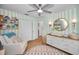 Bright Bedroom with stylish decor, complemented by a charming rug and patterned walls at 1557 77Th N Ave, St Petersburg, FL 33702