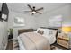 Comfortable bedroom featuring wood-look floors, lots of natural light and calming neutral tones at 1557 77Th N Ave, St Petersburg, FL 33702