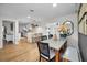 Open-concept dining area with modern furnishings, including a view into the bright, eat-in kitchen at 1557 77Th N Ave, St Petersburg, FL 33702