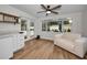 Cozy sunroom featuring a view of the backyard pool area with natural light at 1557 77Th N Ave, St Petersburg, FL 33702