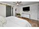 Light-filled primary bedroom boasts a contemporary design with modern furnishings at 1557 77Th N Ave, St Petersburg, FL 33702