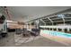 Relaxing screened patio area with views of the shimmering pool and beautifully landscaped backyard at 1557 77Th N Ave, St Petersburg, FL 33702