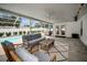 Inviting screened-in patio with comfortable seating and view of the sparkling pool at 1557 77Th N Ave, St Petersburg, FL 33702