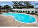 Inviting pool area featuring a sparkling pool, surrounding patio and privacy fence at 1557 77Th N Ave, St Petersburg, FL 33702