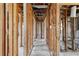 Framed hallway showcasing the layout of the house with exposed wooden beams and construction materials at 1560 Connecticut Ne Ave, St Petersburg, FL 33703