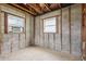 Interior view of a gutted room shows the studs, plumbing, and block walls at 1560 Connecticut Ne Ave, St Petersburg, FL 33703