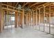 Interior view of a gutted room shows the studs, plumbing, and block walls at 1560 Connecticut Ne Ave, St Petersburg, FL 33703