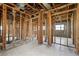 Interior view of a gutted room shows the studs, plumbing, and block walls at 1560 Connecticut Ne Ave, St Petersburg, FL 33703