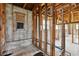 Interior view of a gutted room shows the studs, plumbing, and block walls at 1560 Connecticut Ne Ave, St Petersburg, FL 33703
