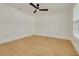 Spacious bedroom with wood-look floors and plenty of natural light at 1723 Cypress Ave, Belleair, FL 33756