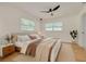 Cozy bedroom with a neutral palette, natural light and hardwood floors at 1723 Cypress Ave, Belleair, FL 33756