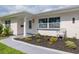 Close-up of the front entrance showcasing the door, landscaping, and address marker at 1723 Cypress Ave, Belleair, FL 33756