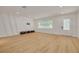 Bright and airy living area featuring modern design elements and beautiful flooring at 1723 Cypress Ave, Belleair, FL 33756