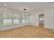Well-lit living space with neutral walls, large windows, and hardwood floors at 1723 Cypress Ave, Belleair, FL 33756