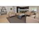 Well-appointed open-concept living room with modern furniture, a view of the kitchen, and stylish decor at 1723 Cypress Ave, Belleair, FL 33756