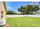 Well-maintained backyard with lush green grass and a white vinyl fence, perfect for outdoor activities at 17302 Stetson Ln, Odessa, FL 33556