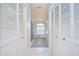 Elegant bathroom with dual closets leading to the tub and shower area at 17302 Stetson Ln, Odessa, FL 33556