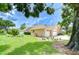 Charming home featuring a manicured lawn and a spacious three-car garage at 17302 Stetson Ln, Odessa, FL 33556