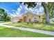 Charming single Gathering home with manicured lawn and three car garage at 17302 Stetson Ln, Odessa, FL 33556