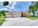 Charming single Gathering home with manicured lawn and three car garage at 17302 Stetson Ln, Odessa, FL 33556