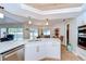 Contemporary kitchen with stainless steel appliances, white cabinets, and a spacious quartz countertop at 17302 Stetson Ln, Odessa, FL 33556