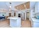 Open kitchen featuring a center island, stainless appliances and eat-in dining area at 17302 Stetson Ln, Odessa, FL 33556