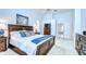 Bright main bedroom with a vaulted ceiling, a comfortable bed, and tasteful decor at 17302 Stetson Ln, Odessa, FL 33556