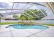 Inviting pool with spa and screen enclosure at 17302 Stetson Ln, Odessa, FL 33556