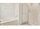Bright bathroom featuring a separate tub and shower with modern fixtures at 1734 Mapleleaf Blvd, Oldsmar, FL 34677