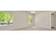 Bright bedroom with neutral carpet, ceiling fan, and sun-filled double windows at 1734 Mapleleaf Blvd, Oldsmar, FL 34677