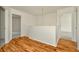 Upstairs landing showcasing hardwood flooring and access to multiple rooms at 1734 Mapleleaf Blvd, Oldsmar, FL 34677