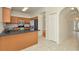 Open kitchen features a breakfast bar and stainless steel appliances at 1734 Mapleleaf Blvd, Oldsmar, FL 34677