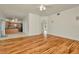 Inviting living room showcases gleaming hardwood floors and access to the kitchen at 1734 Mapleleaf Blvd, Oldsmar, FL 34677