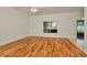Inviting living room with hardwood floors, a ceiling fan, and a backyard view at 1734 Mapleleaf Blvd, Oldsmar, FL 34677