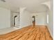 Spacious open living area with hardwood floors, arched doorway and staircase at 1734 Mapleleaf Blvd, Oldsmar, FL 34677