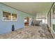 Covered brick patio with spa, perfect for outdoor relaxation and entertainment at 1734 Mapleleaf Blvd, Oldsmar, FL 34677