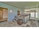 Relaxing covered patio with a spa, offering privacy and comfort at 1734 Mapleleaf Blvd, Oldsmar, FL 34677
