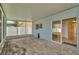 Covered brick patio features sliding glass doors and ample room for entertaining at 1734 Mapleleaf Blvd, Oldsmar, FL 34677