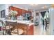 Beautiful kitchen with cherry wood cabinets, granite countertops and stainless steel appliances at 1827 Peaceful Palm St, Ruskin, FL 33570